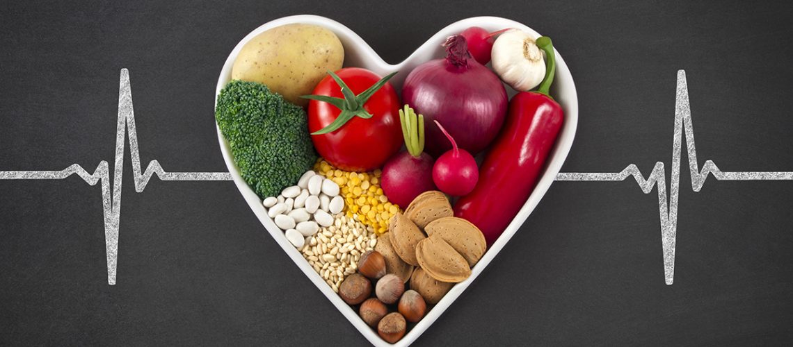 Vegetables in Heart Shaped Bowl on Blackboard