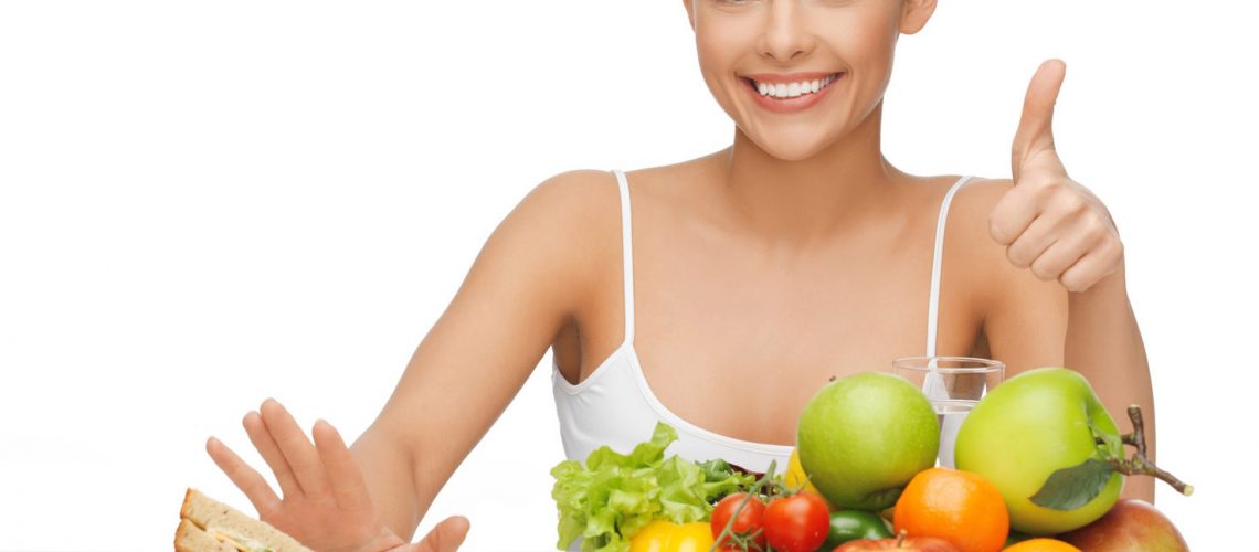 woman with fruits showing thumbs up