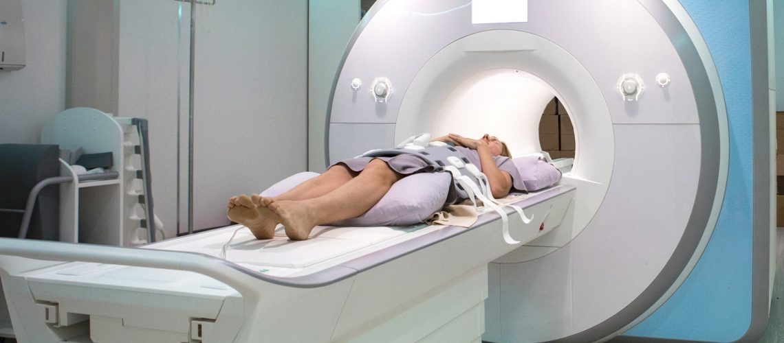 Female patient lies and waits for her MRI scan