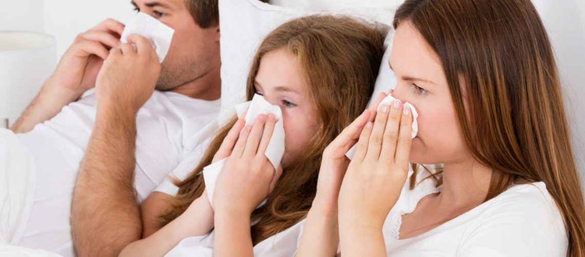 Family Lying On Bed Blowing Their Nose; Shutterstock ID 495040744; PO: NOVEMBRE